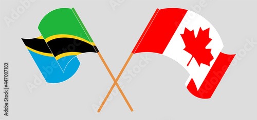 Crossed and waving flags of Tanzania and Canada