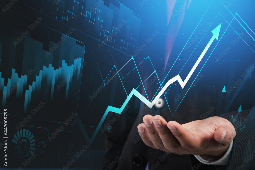 Businessman hand hold hologram blue arrow, trading and analyzing stock data to apply new strategy to beat the market. Businessman hand hold hologram blue arrow, trading and analyzing stock data to apply new strategy to beat the market.