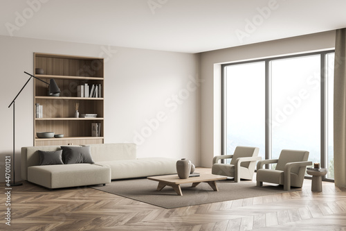 Beige living room with panoramic view and niche bookshelf photo