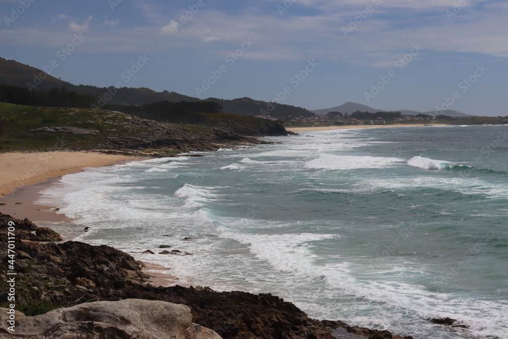 Image of a Galician beach with waves and rocks, in Castros de Baroña, La Coruña, Galicia, Spain.