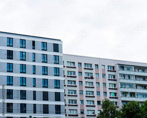 modern and plattenbau building in a row
