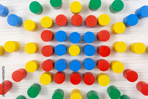 Colorful toy flower with wooden blocks for children on white table. Games for kindergarten, preschool or daycare. Education, back to school concept. Close up pattern