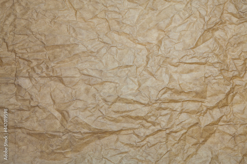 Textured brown paper background.