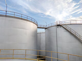 Oil storage tank In industrial areas. Crude oil storage plant For export. Palm oil factories in Asia. The atmosphere industry zone
