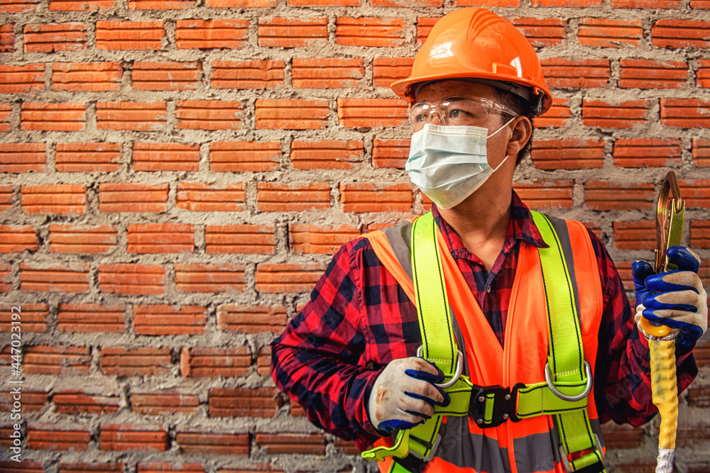 Worker man with safety helmet Construction building industry, new home, construction interior service concepts - Selective focus..vintage film grain filter effect styles Worker man with safety helmet Construction building industry, new home, construction interior service concepts - Selective focus..vintage film grain filter effect styles