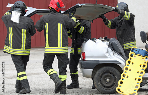 firefighters during rescue of the injured after the car accident with the stretcher