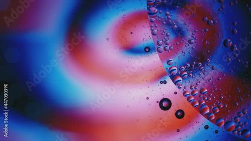 Fluid. Вubbles in Space with Bright Colored Light. Macro.