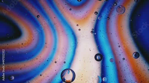 Fluid. Вubbles in Space with Bright Colored Light. Macro.