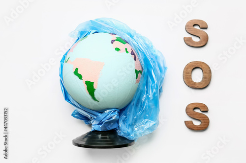 Globe in garbage bag with w...