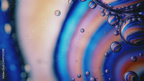 Fluid. Вubbles in Space with Bright Colored Light. Macro.