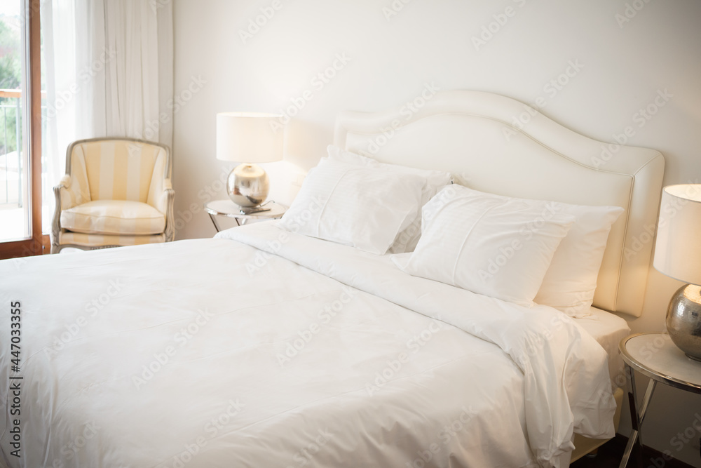 big white bed with pillows