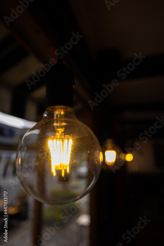 Decorative hanging lightbulb in a local coffee shop