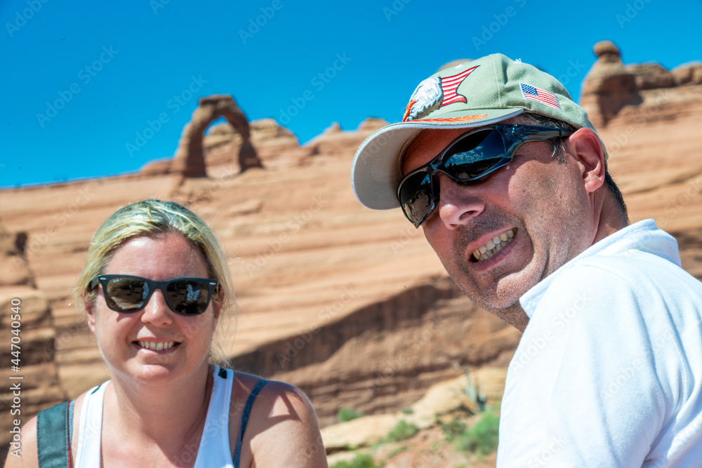 Happy couple enjoying a moment in arches national park.