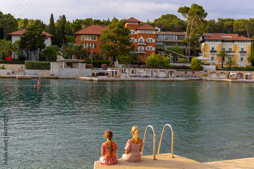 Girls on a beach in Mali Lošinj, Croatia photo