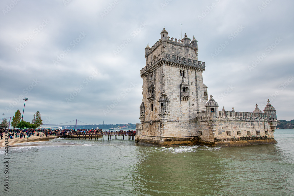 Naklejka premium LISBON, PORTUGAL - NOVEMBER 3, 2018: Tourists visit Belem Tower.