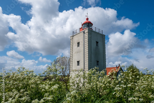 Lighthouse De Ven from 1700 on the IJsselmeerdijk between Andijk and Enkhuizen, Noord-Holland Province, The Netherlands photo
