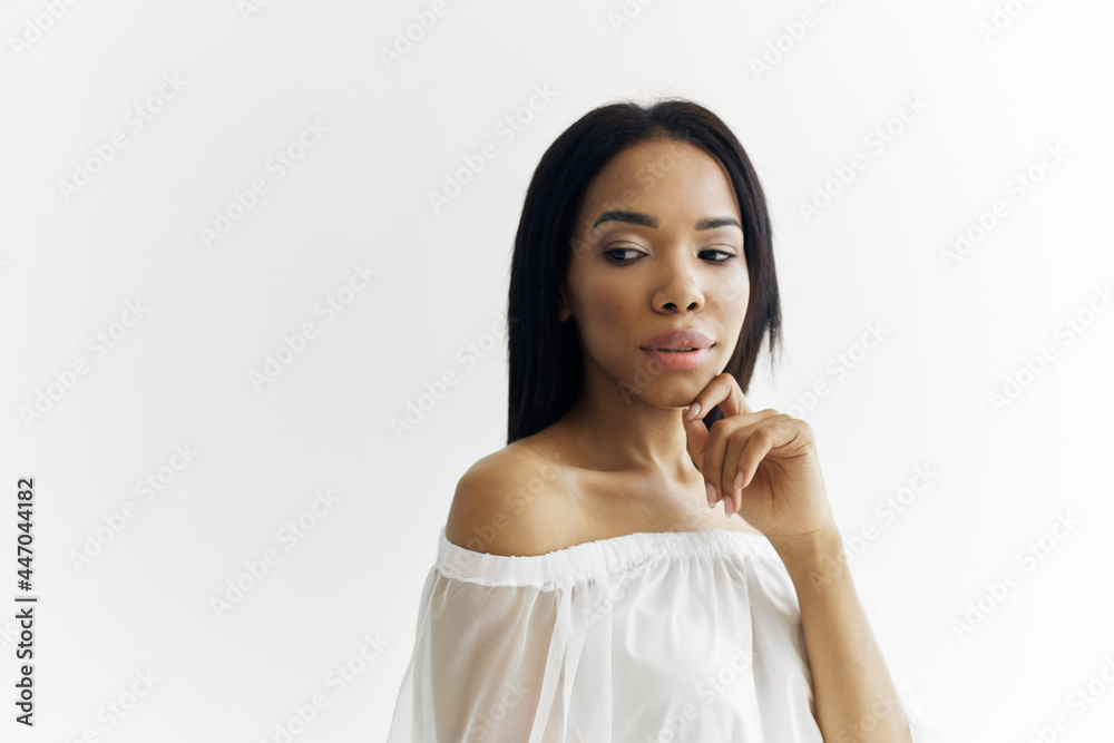 woman african appearance in white dress posing cosmetics luxury light background woman african appearance in white dress posing cosmetics luxury light background