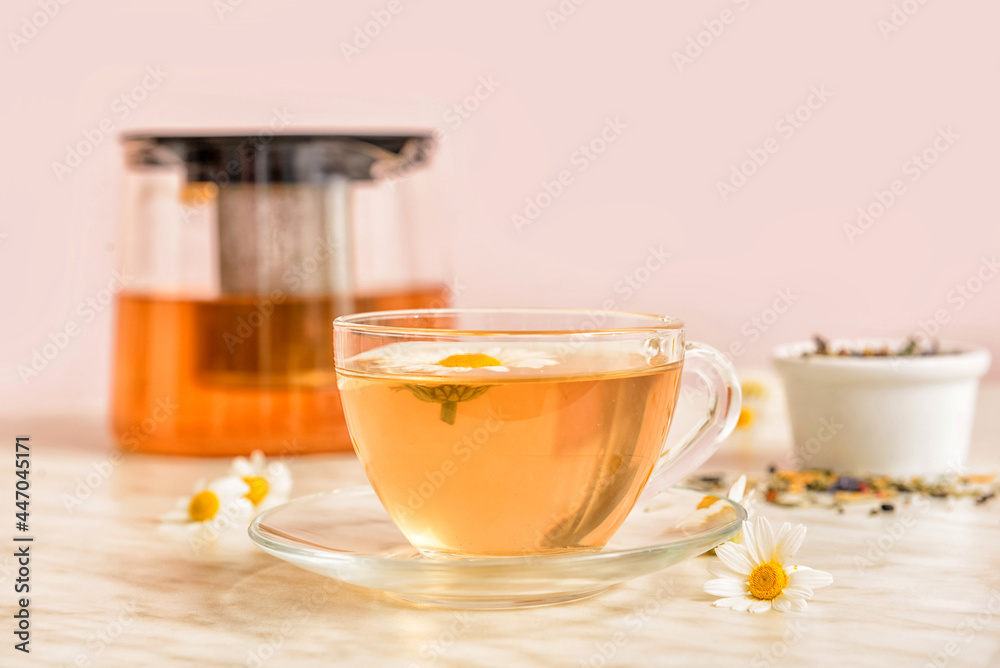 Cup of floral tea on table Cup of floral tea on table