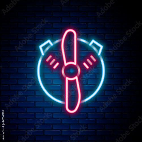 Glowing neon line Plane propeller icon isolated on brick wall background. Vintage aircraft propeller. Colorful outline concept. Vector