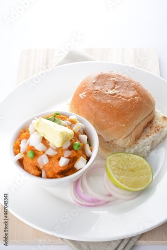 Indian vegetable bean curry with baked bread bun toast in white background vegan dim sum Halal menu photo