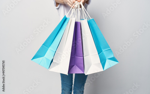 woman with packages in hands shopping fun Shopaholic close-up
