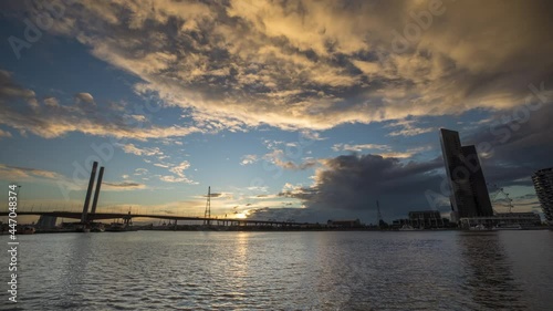Sunset timelapse video of Bolte Bridge at District Docklands in Melbourne CBD, Australia
