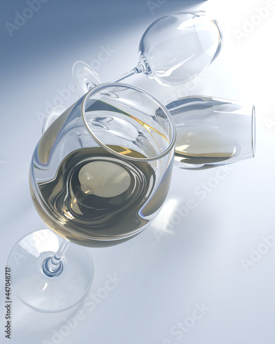 White wine in crystal glasses in various surreal positions. Light refracted in liquid and glass.