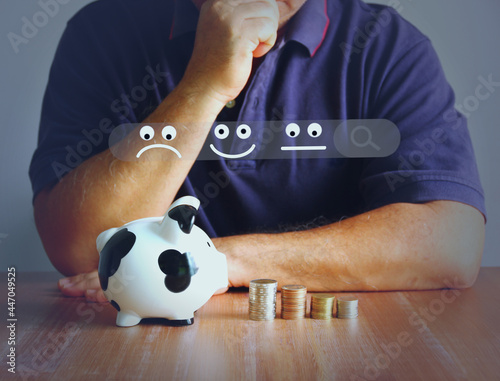 Asian man with piggy bank coins stacking illustration of emotion and search channel. man is sloving financial problems with saving options photo