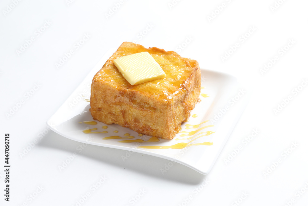 thick egg french toast with butter and honey in white background snack halal menu