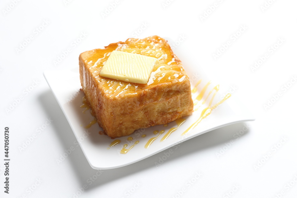 thick egg french toast with butter and honey in white background snack halal menu thick egg french toast with butter and honey in white background snack halal menu