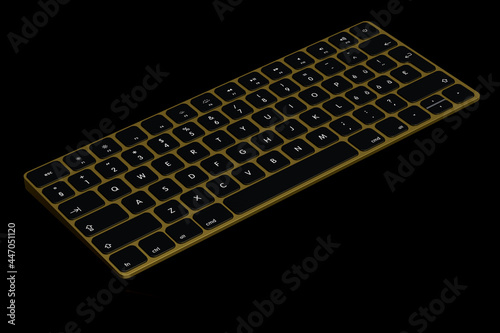Modern gold aluminum computer keyboard isolated on black background.