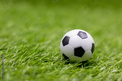 Soccer ball is on green grass © thaninee