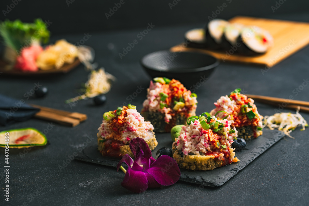 Sushi. Sushi with surimi. Decorated sushi with surimi, wasabi and ginger.  - obrazy, fototapety, plakaty 
