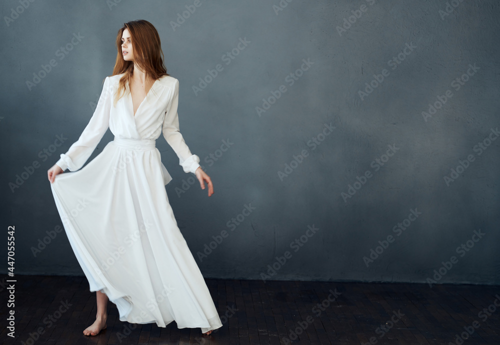 pretty woman in white dress dancing dark background lifestyle pretty woman in white dress dancing dark background lifestyle