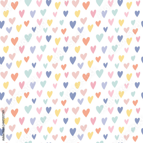 Cute simple childish seamless pattern with hand drawn watercolor rainbow colors hearts on white backdrop. Sweet vector background. Children textile, fabric, print, wrapping paper, texture, surface.