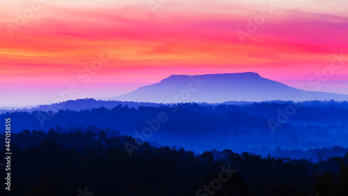 Scenery of blue mountain and sunrise sky.