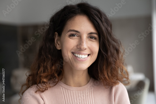 Free Download Headshot portrait of smiling millennial Latino woman look at camera pose in home feel optimistic. Profile picture of happy young Hispanic female show white healthy teeth. Diversity concept. - GFXLoad