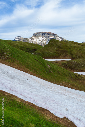 the mountains of the Ossola Valley around dinner time, inside the Alpe Veglia - Devero Natural Park, near the town of Baceno, Italy - July 2021. photo