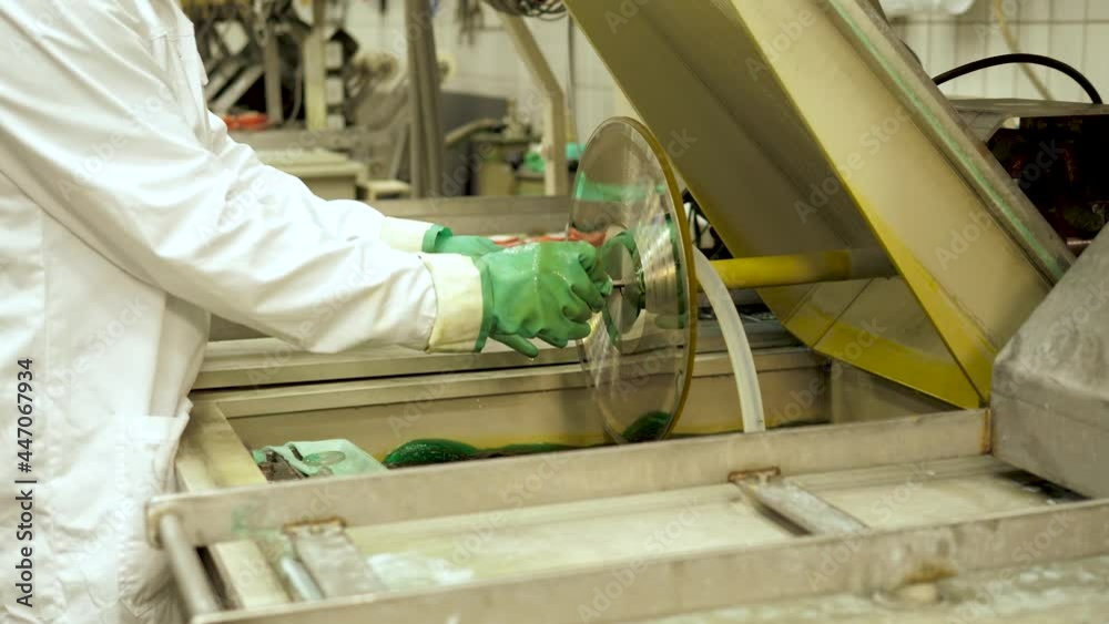 Vinyl record factory: Lacquer is dipped into a nickle bath, where an electro charge fuses the nickle to the silver. Vinyl record factory: Lacquer is dipped into a nickle bath, where an electro charge fuses the nickle to the silver.