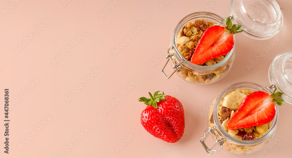 Muesli with fruits and strawberries. Keeping a healthy breakfast. Granola healthy food dessert snack. Diet concept. Vegetarian food. Copy space. Muesli with fruits and strawberries. Keeping a healthy breakfast. Granola healthy food dessert snack. Diet concept. Vegetarian food. Copy space.