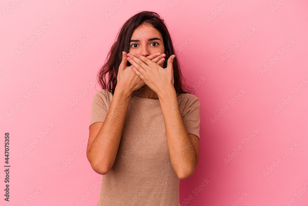 Young caucasian woman isolated on pink background covering mouth with hands looking worried. Young caucasian woman isolated on pink background covering mouth with hands looking worried.