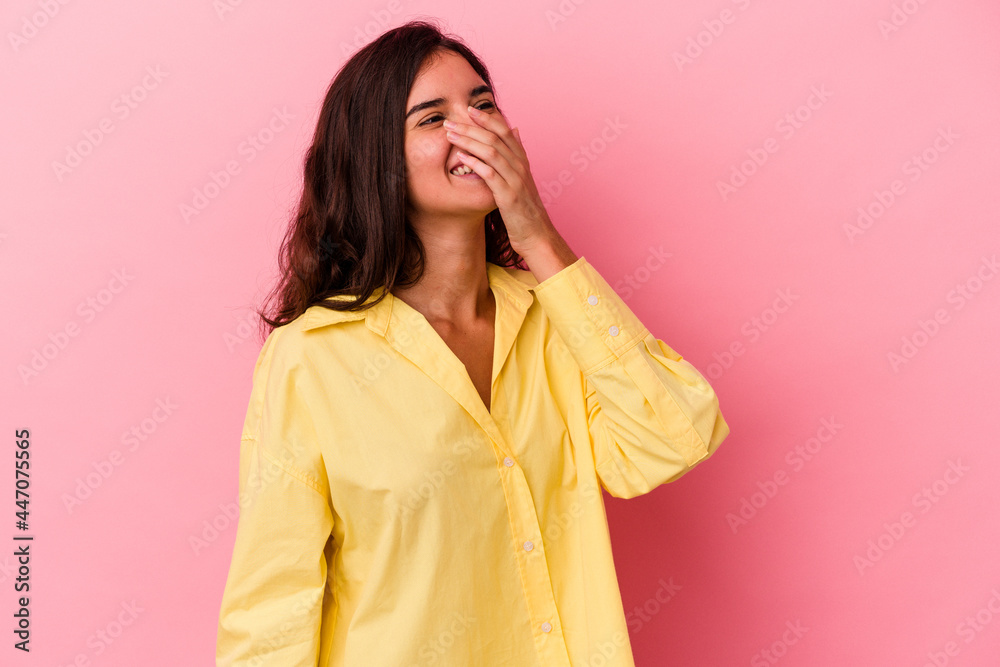 Young caucasian woman isolated on pink background laughing happy, carefree, natural emotion. Young caucasian woman isolated on pink background laughing happy, carefree, natural emotion.