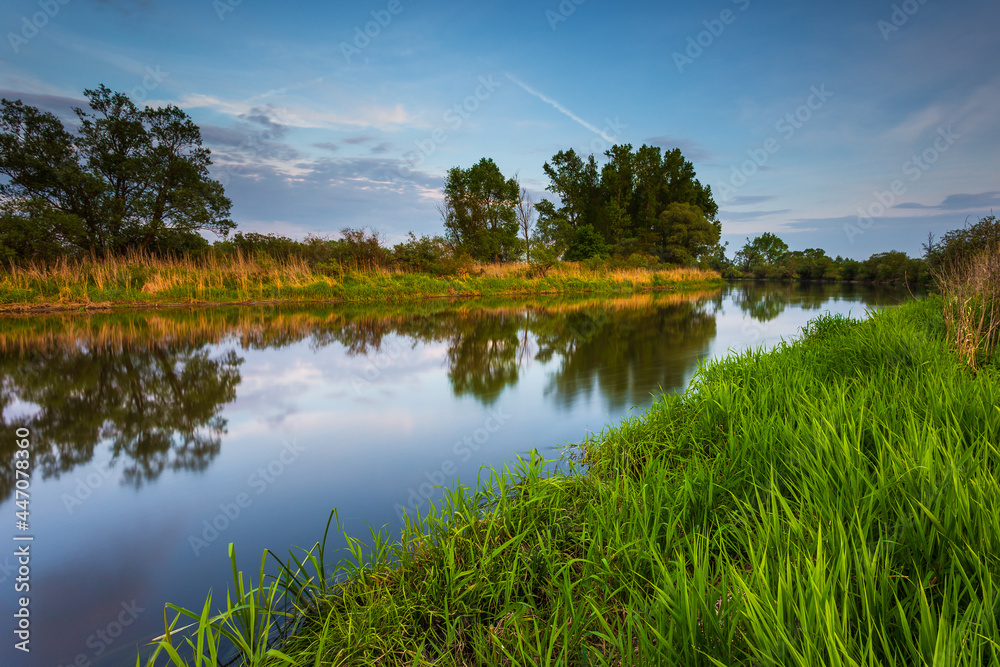 Sunset over Warta river in Warta Landscape Park, Poland. Sunset over Warta river in Warta Landscape Park, Poland.