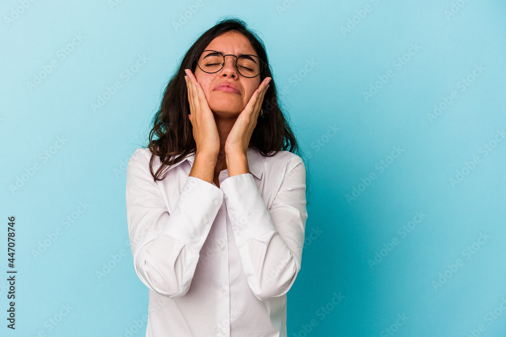 Young caucasian woman isolated on blue background crying, unhappy with something, agony and confusion concept. Young caucasian woman isolated on blue background crying, unhappy with something, agony and confusion concept.