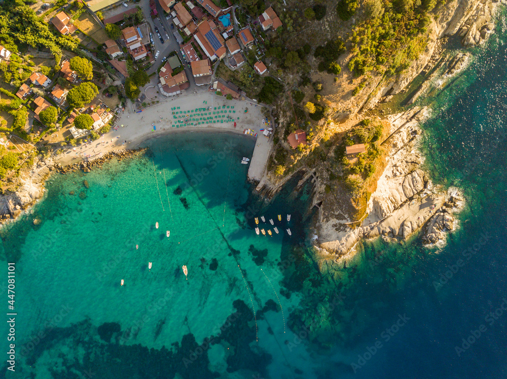 Aerial drone panorama view of the coast line, beach and crystal clear water of elba close to Sant'Andrea, Italy