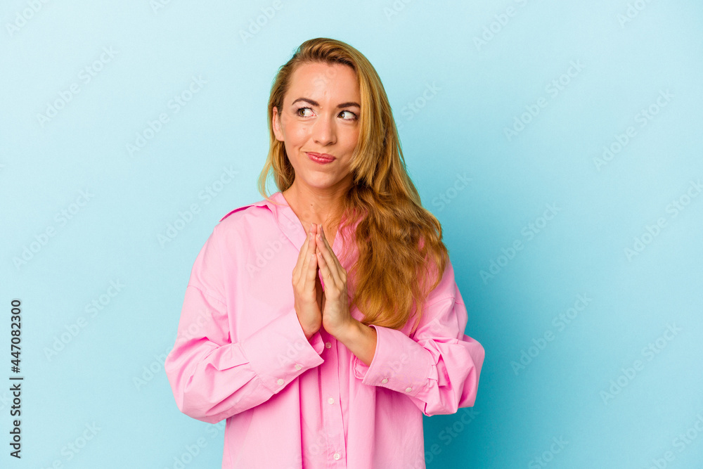Caucasian woman isolated on blue background making up plan in mind, setting up an idea. Caucasian woman isolated on blue background making up plan in mind, setting up an idea.