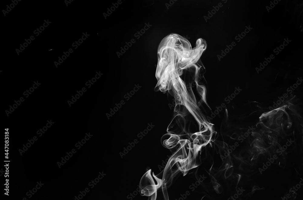 abstract fragment movement of white smoke on black background.