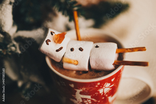 happy snowman in hot chocolate  photo