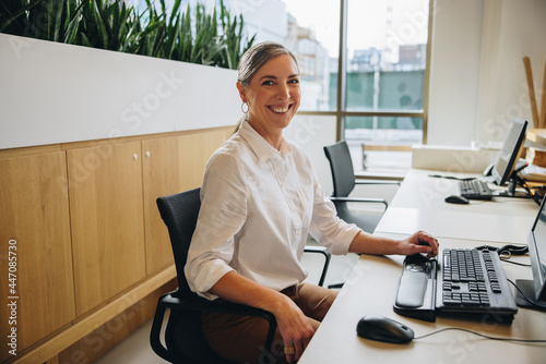 Friendly receptionist working in office