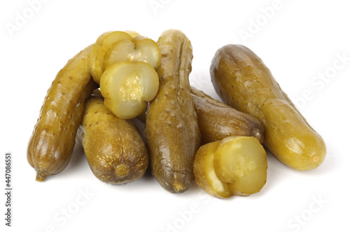 pickled cucumber cut in half on white background